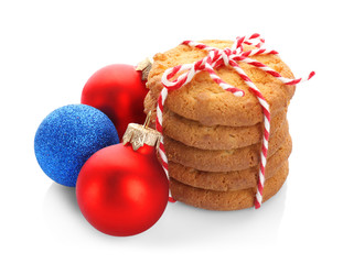 Tasty Christmas cookies and decor on white background