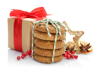 Tasty Christmas cookies and decor on white background