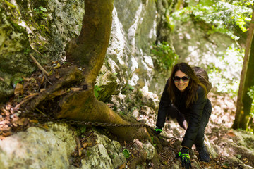 Hikers climbing on mountain wall