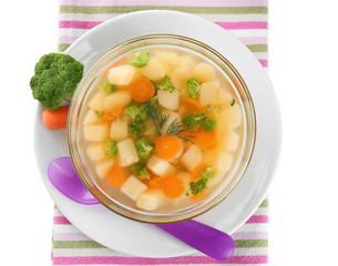 Bowl of delicious baby soup on table