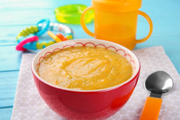 Bowl of creamy baby vegetable soup on table