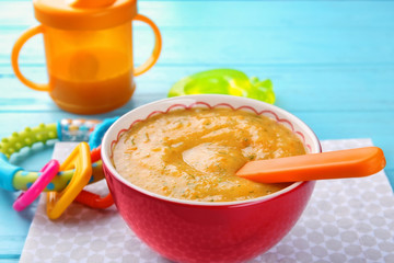 Bowl of creamy baby vegetable soup on table