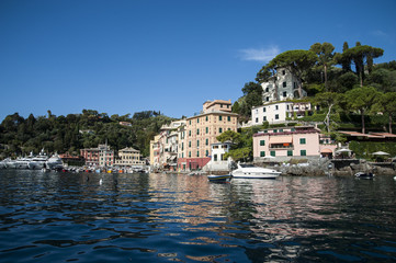 Portofino, Liguria Italia - watching the coast from the sea. View of the bay of Portofino, one of the most popular village on the Italian Riviera.