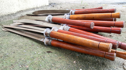 Many swords are placed on the ground.