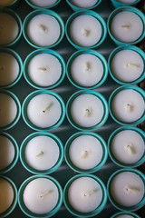 A lot of new mint color candles. Top view