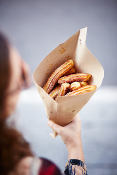 Woman holding churros