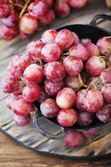 Sweet red grape on the wooden table