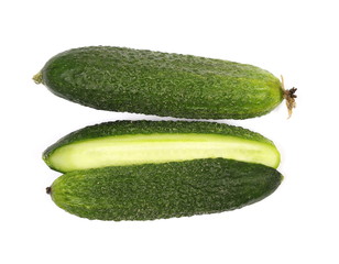 Small cucumbers with slices isolated on white background, top view