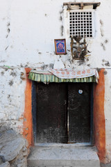 Door with amulets in the ancient Buddhist mountain village