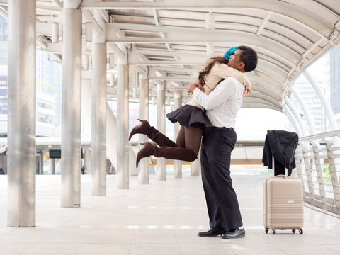 Woman Traveler With Bag, Luggage, Suitcase Arrival At The Airport During Traveling,.travel Say Good Bye And Hug Her Husband