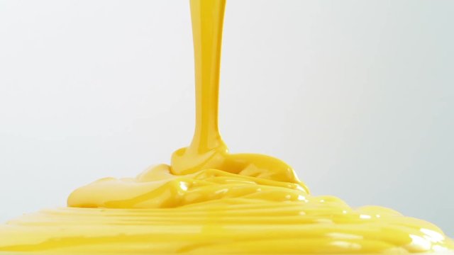 Yellow Paint Pours on White Background