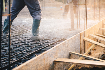 Concrete pouring during commercial concreting floors of buildings in construction - Powered by Adobe