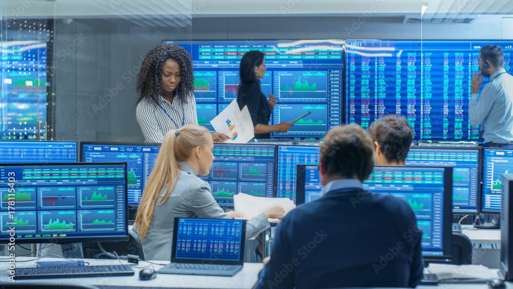 Poster multi-ethnic team of traders is busy working at the stock exchange office. dealers and brokers buy a