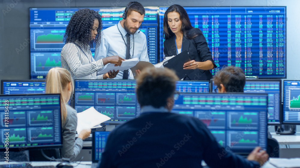 Poster multi-ethnic team of traders is busy working at the stock exchange office. dealers and brokers buy a
