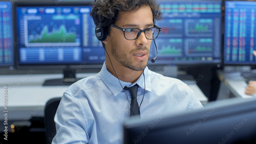 Poster Customer Support Service Representative Talks with a Client Through Headset. He's Working in a Big Technical Consulting Company.