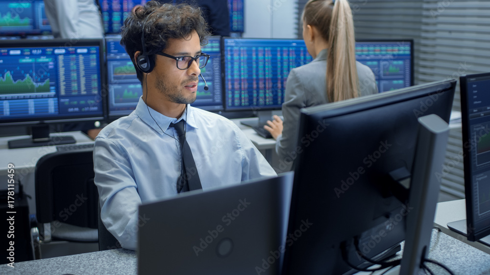 Poster Stock Trader Making Sales with a Headset. In the Background Stock Exchange Office and Group of Traders Working at their Workstations.