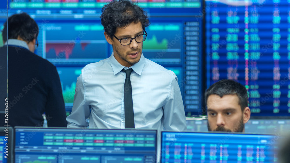 Aufkleber stock trader inspects others work and chat with other. busy office with multi-ethnic team of brokers