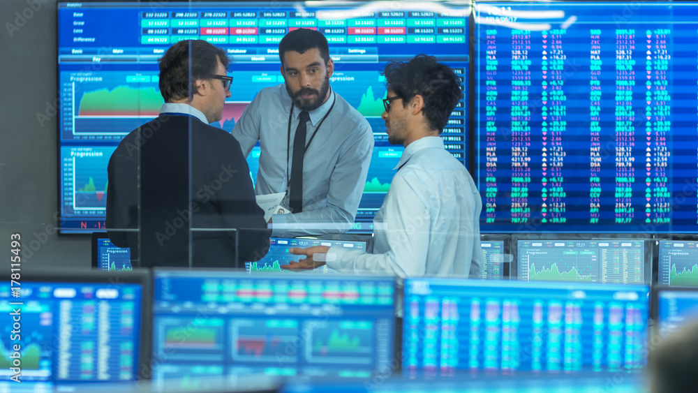 Poster three experienced stock traders talking business. they work for a big stock exchange firm. office is