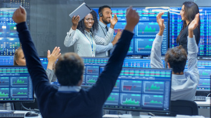 Multi-Ethnic Team of Traders Have Successful Day at the Stock Exchange Office. Dealers and Brokers...
