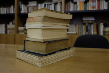 pile of books in the library