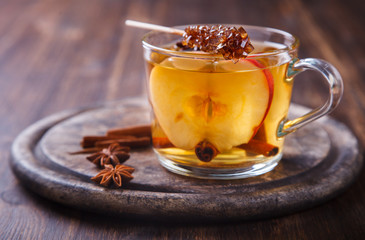 Apple Cider Drink,Juice,Cider with Spices ,Cinnamon sticks and fresh Apples.Hot drink for Autumn and Winter Christmas evenings.selective focus.