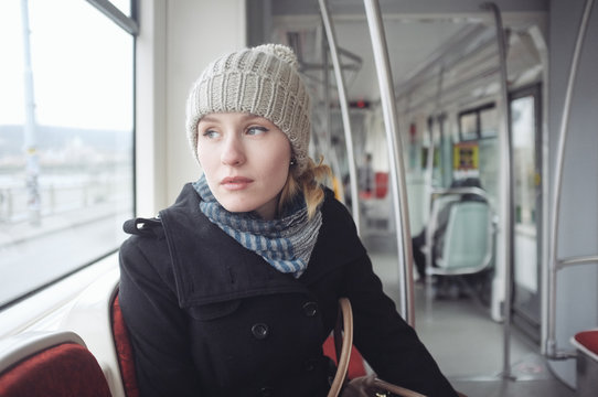 young woman in a tram