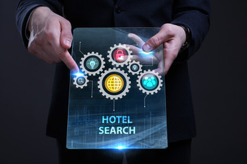 Business, Technology, Internet and network concept. Young businessman working on a virtual screen of the future and sees the inscription: Hotel search