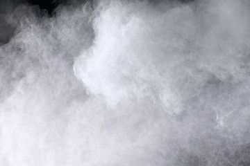 Explosion of colored powder isolated on black background.