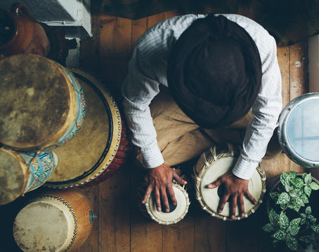 Indian man playing traditional indian drums