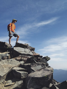 Male hiker standing on mountain summit