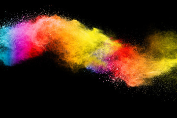 Splash of colorful powder over black background.