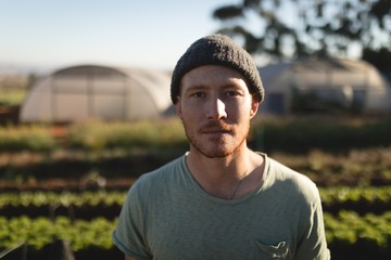 Portrait of farmer standing on farm