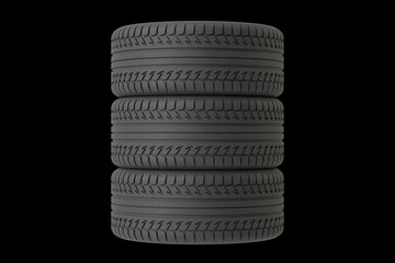 Three tyres on black background