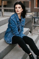 Beautiful brunette young woman walking on the street
