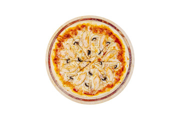 Delicious pizza with mushrooms and chicken on a wooden stand isolated on a white background. Top view