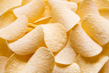 Golden Chips potato texture. Food Background of delicious chips