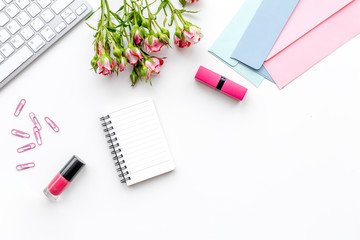 woman desk design with cosmetics, petals and notebook white background top view mock-up