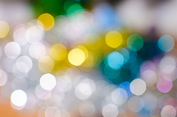 Fototapeta premium Bright colorful Christmas background, blurred bokeh holiday
