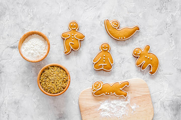 Make gluten free healthy food. Yoga asanas cookies near desk, flour and wheat on stone background...