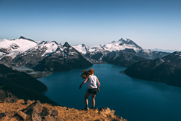 Fototapeta na wymiar Girl standing over Panorama Ridge, BC