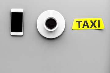 Choose a taxi in mobile application. Grey background top view copyspace
