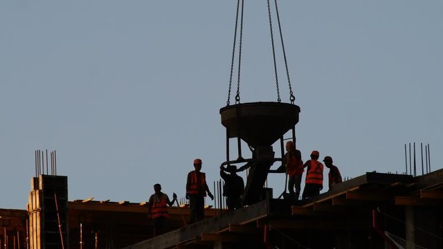 Crane lifting construction material