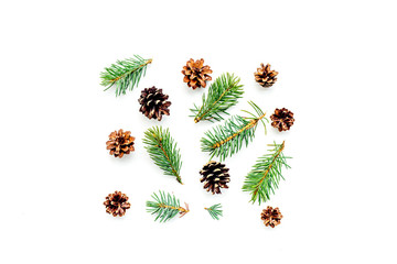 New year symbols pattern. Spruce branches and cones on white background top view copyspace