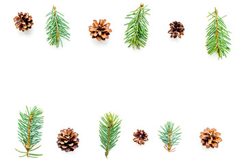 New year symbols pattern. Spruce branches and cones on white background top view copyspace