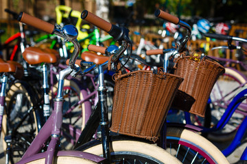 Obraz premium Vintage black bicycle with basket parked on the street retro wallpaper background shallow focus