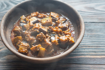 Bowl of aubergine with rogan josh sauce