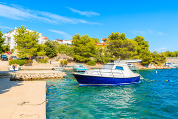 Fototapeta na wymiar Boat in beautiful sea bay between Sibenik and Primosten towns, Dalmatia, Croatia