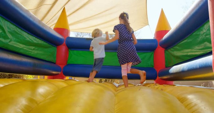Kids playing on the bouncing castle 