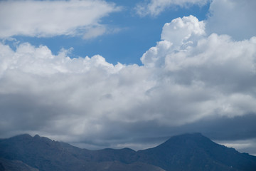 volcanic mountains and sky with clouds