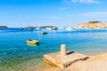 Small platform for mooring boats on beautiful beach in Primosten town, Dalmatia, Croatia